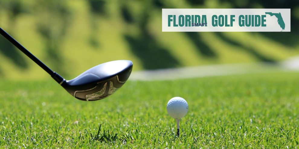 A close-up of a golf club poised to strike a golf ball on a tee in a sunny green setting with a Florida Golf Guide logo in the corner.