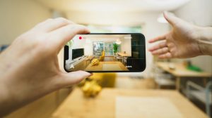 A person taking a picture of a kitchen